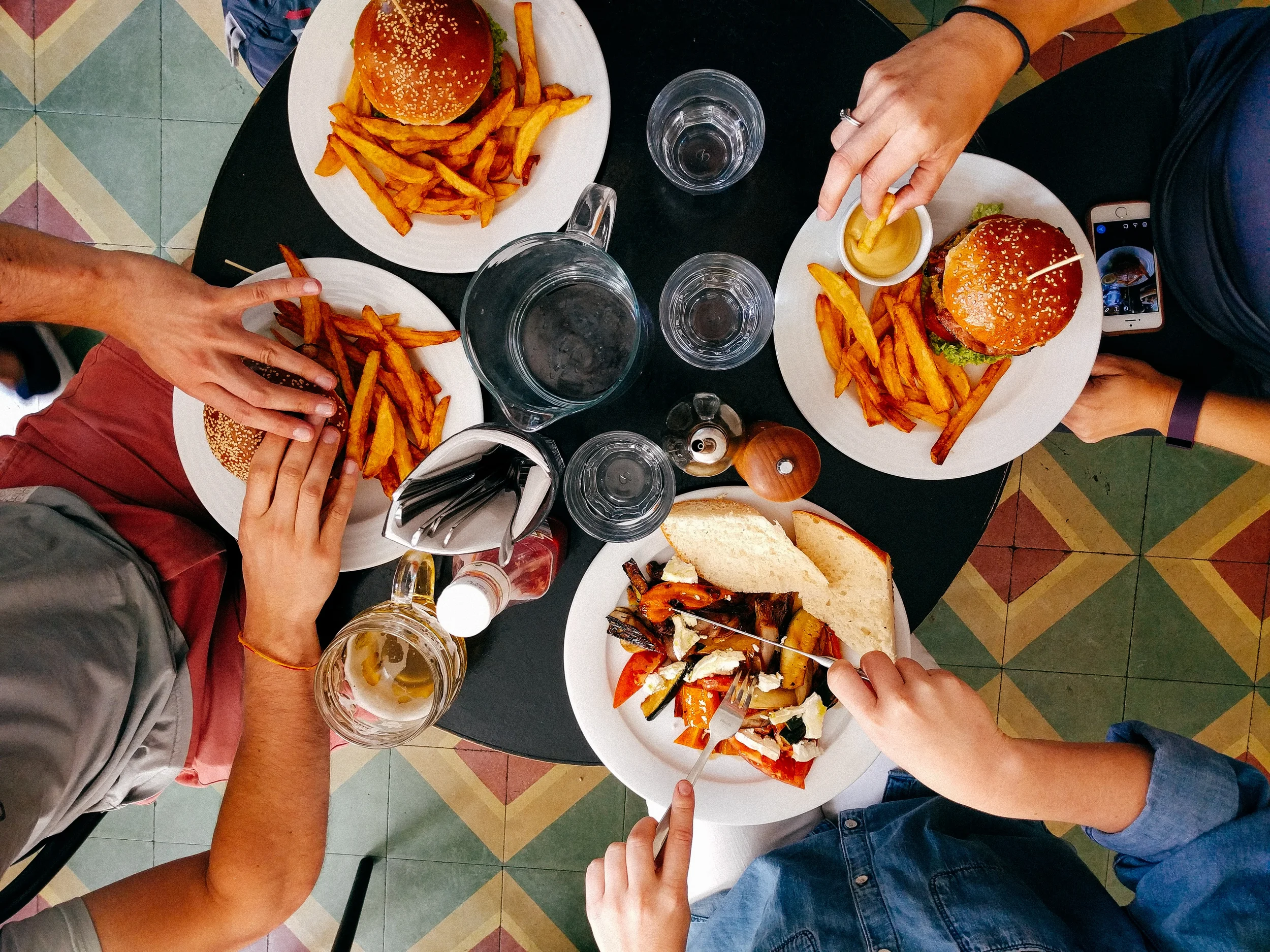 people eating burgers